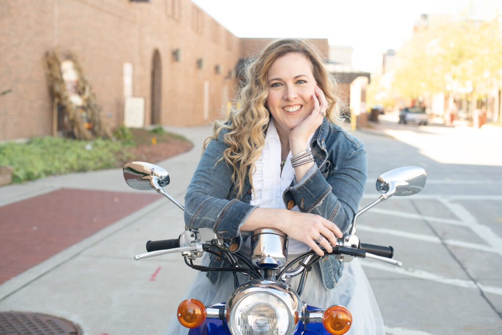 Nik Stephens on her Yamaha Vino Scooter.